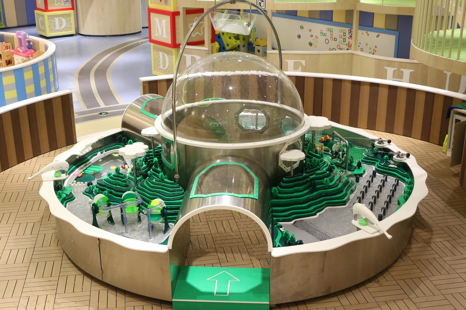 Ring basin with a clear domed tunnel — installed water play zone